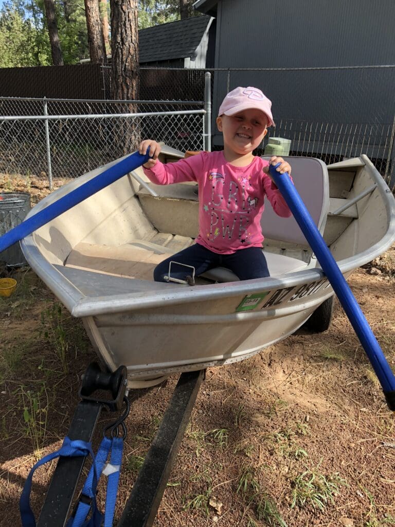 Lily rowing a boat