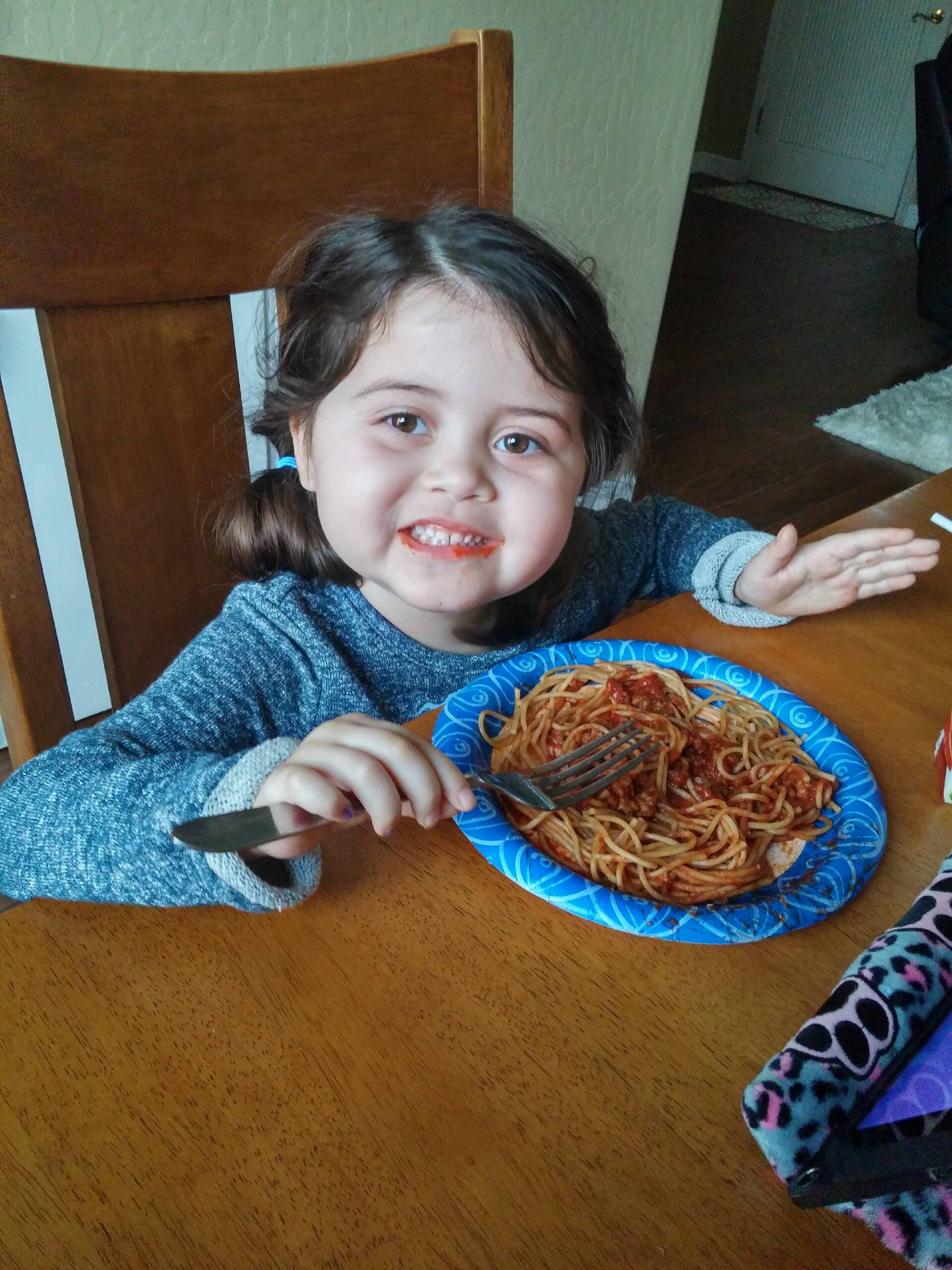 Lily eating spaghetti